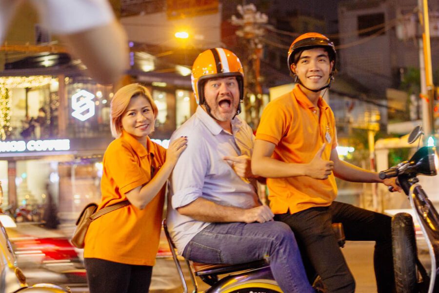 Vespa Saigon after dark - Vietnam classic tours