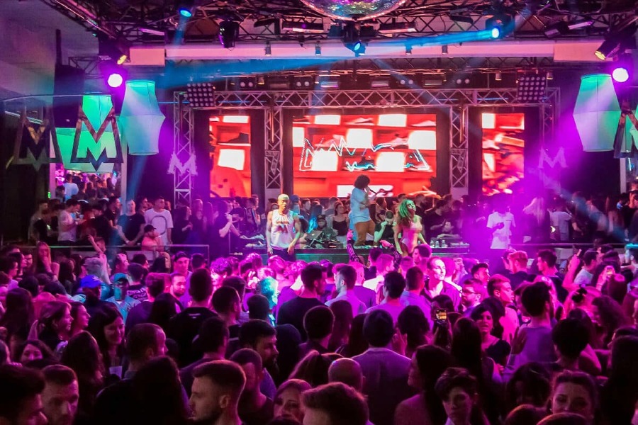 Hanoi nightclub with colorful lights and a lively dance floor 1